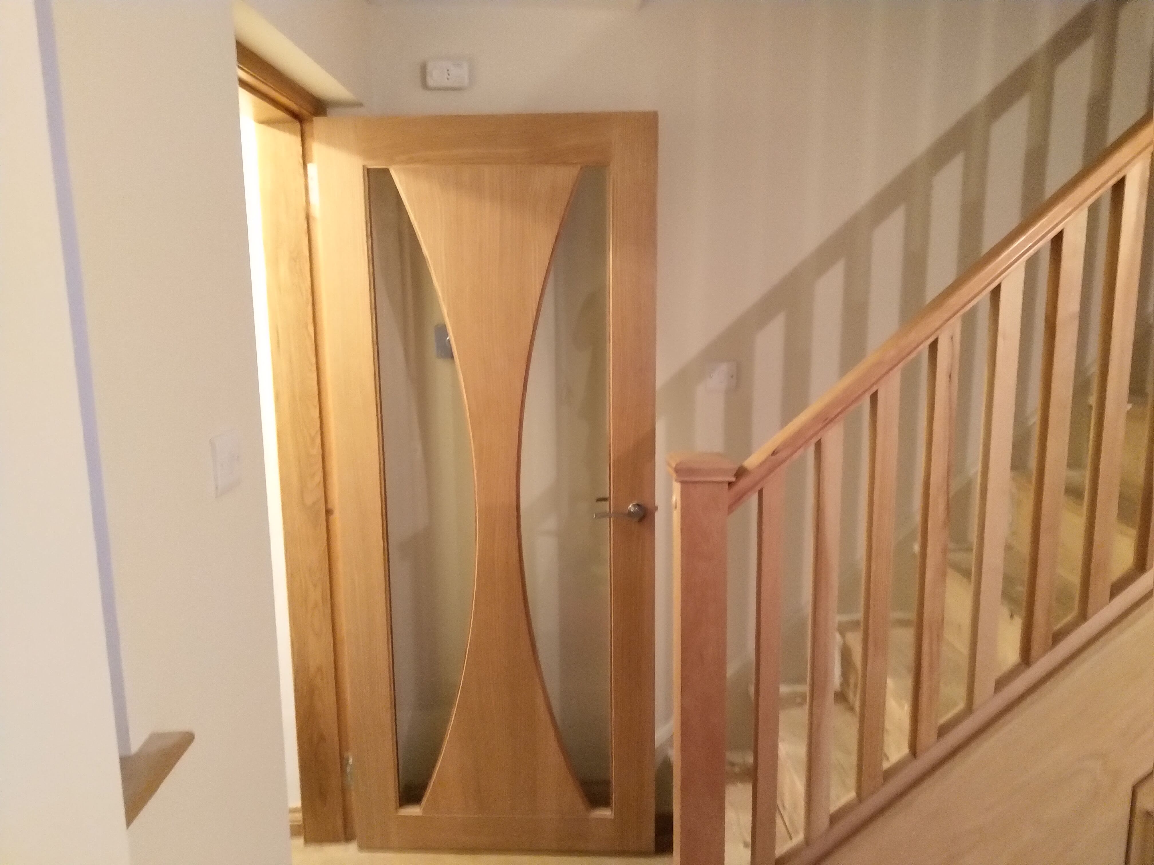 Bespoke engineered oak glazed internal door fitted in Glasgow