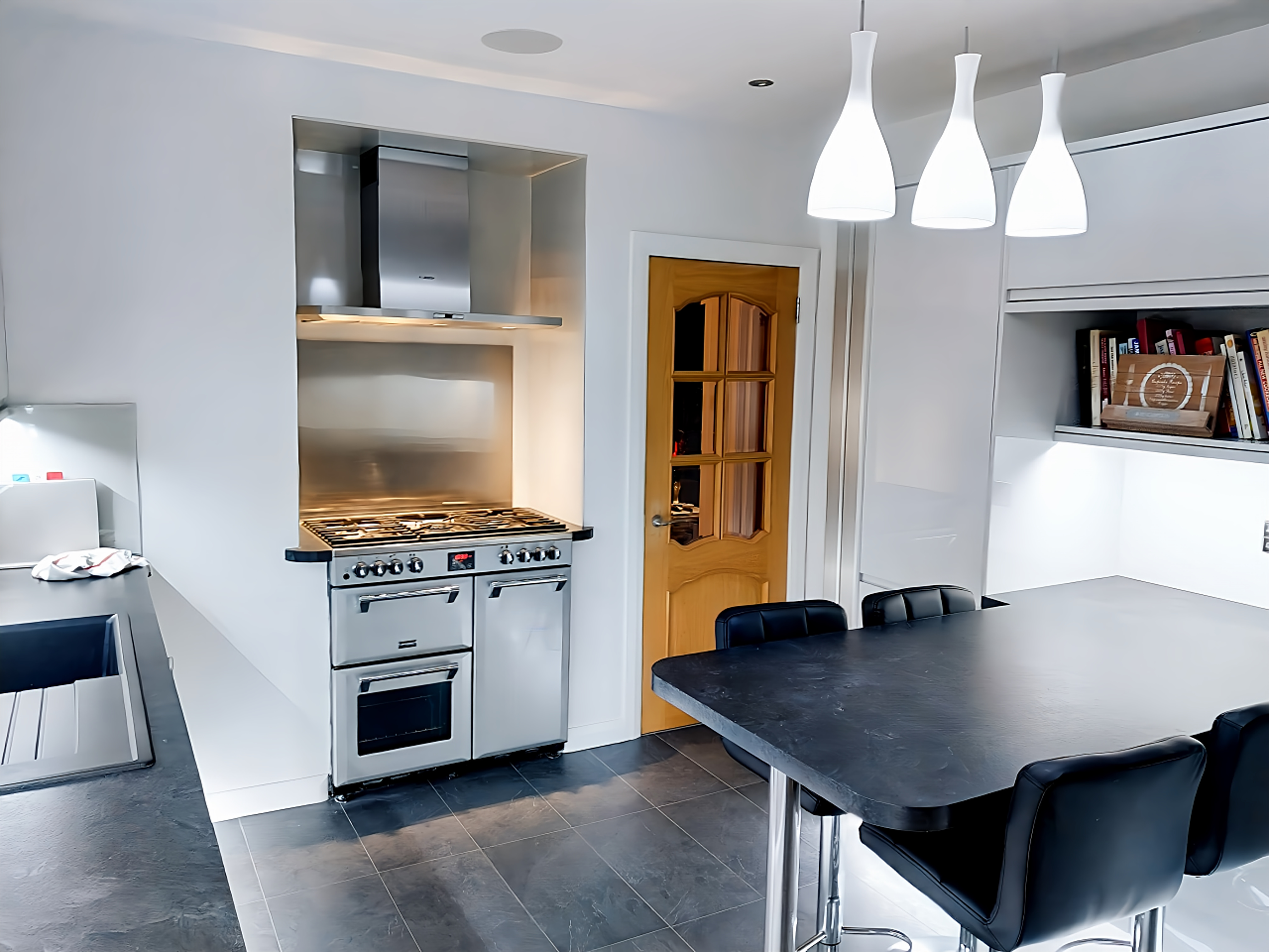 Integrated kitchen appliances and custom cabinet framing details