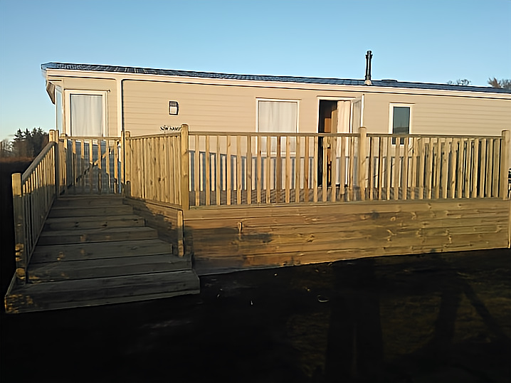Elevated timber decking platform with safety balustrade